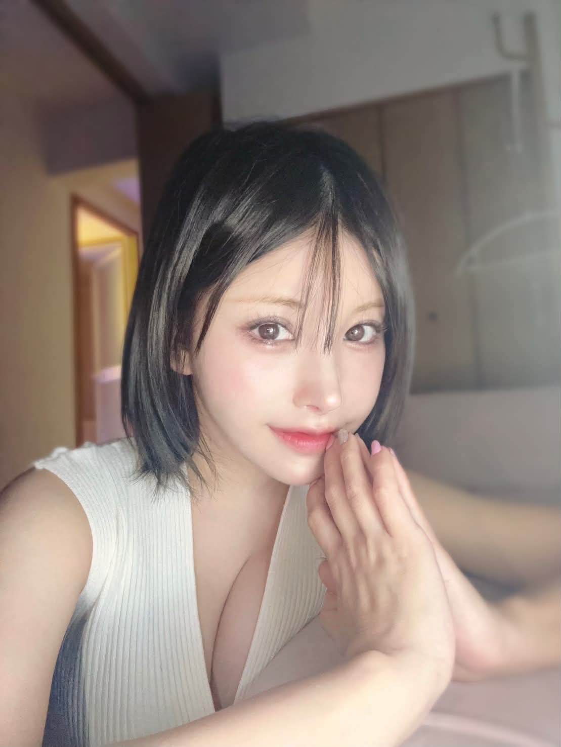 Rena in a calm prayer pose